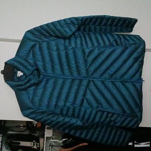 XL teal slightly puffer jacket with stand-up collar and zipper closure.